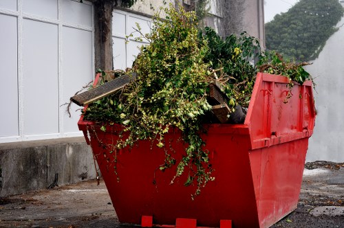 Electric low-emission waste collection van on a city street