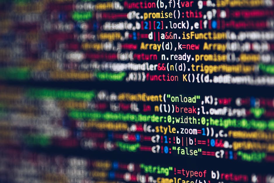 A close-up image of a computer screen displaying multicolored programming code with syntax highlighting. The code features various elements such as functions, variables, keywords, and operators, writt